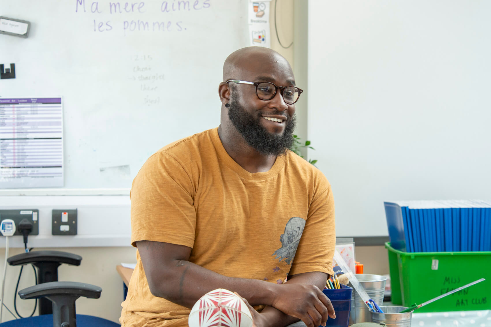 A male teacher in a classroom 