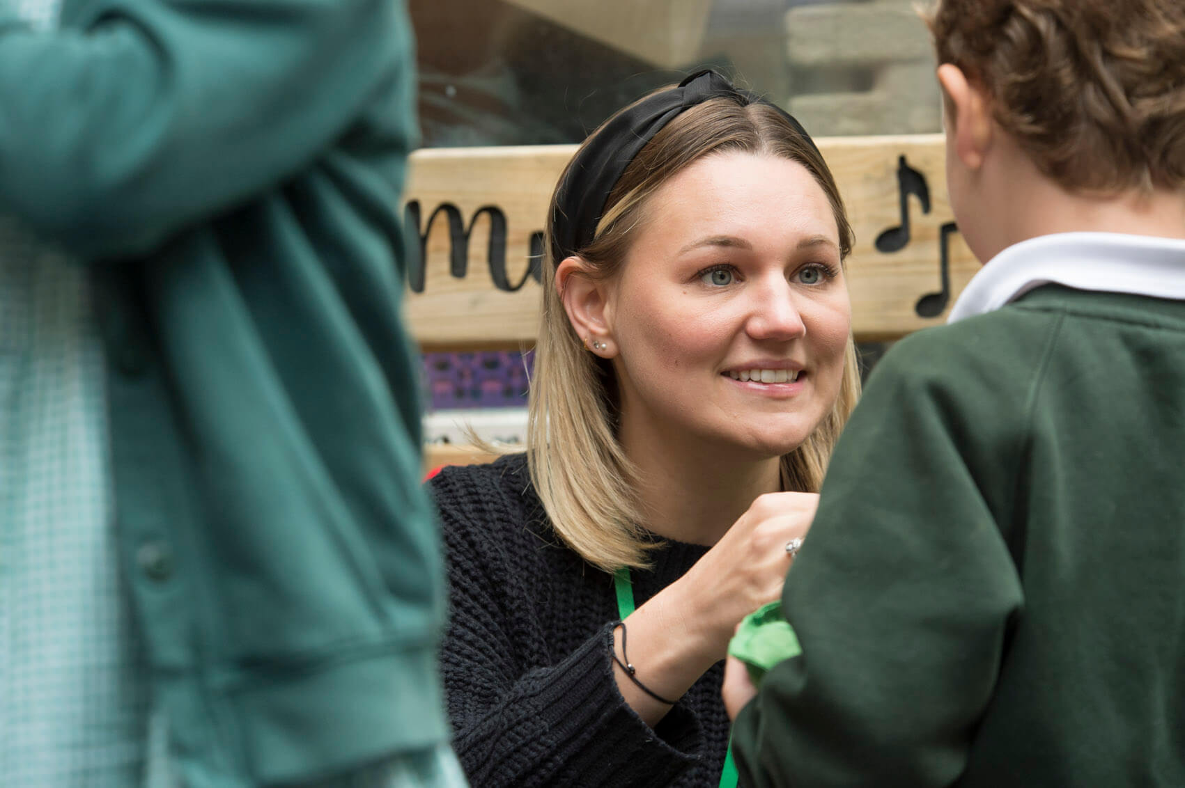 Teaching Assistant talking to a pupil 