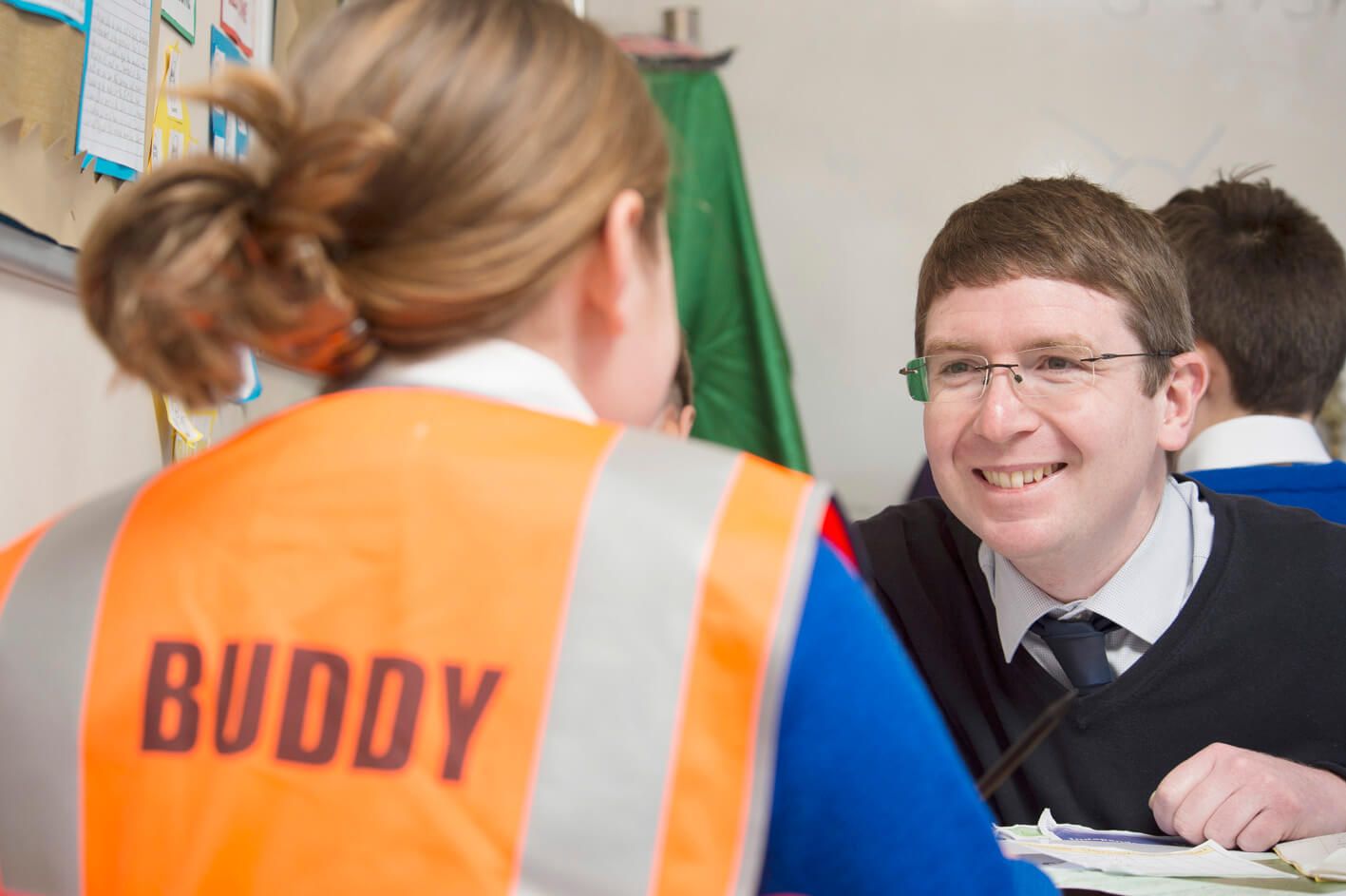 Male teacher talking to a student 