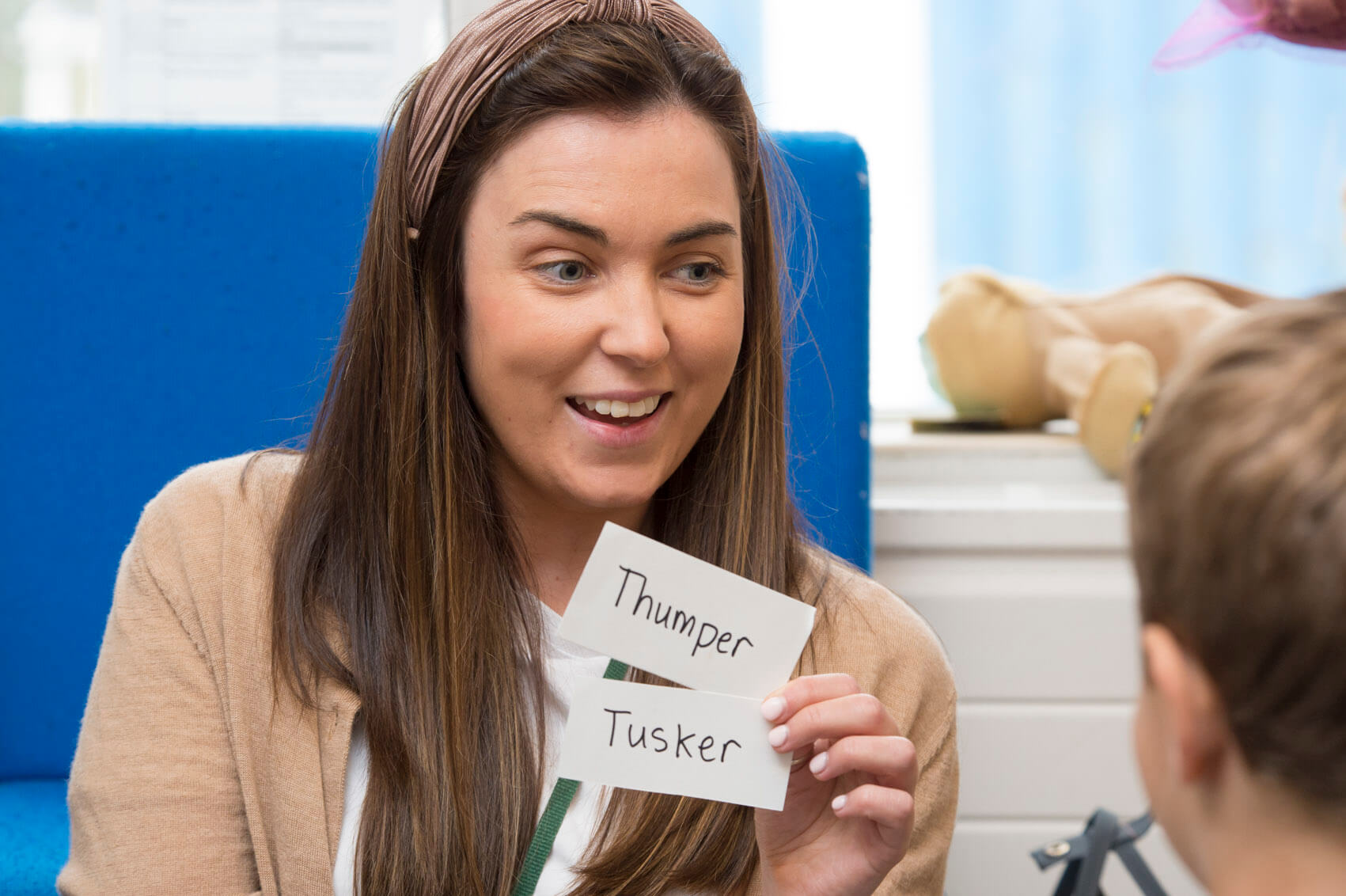 Primary school teacher doing spellings with pupils 