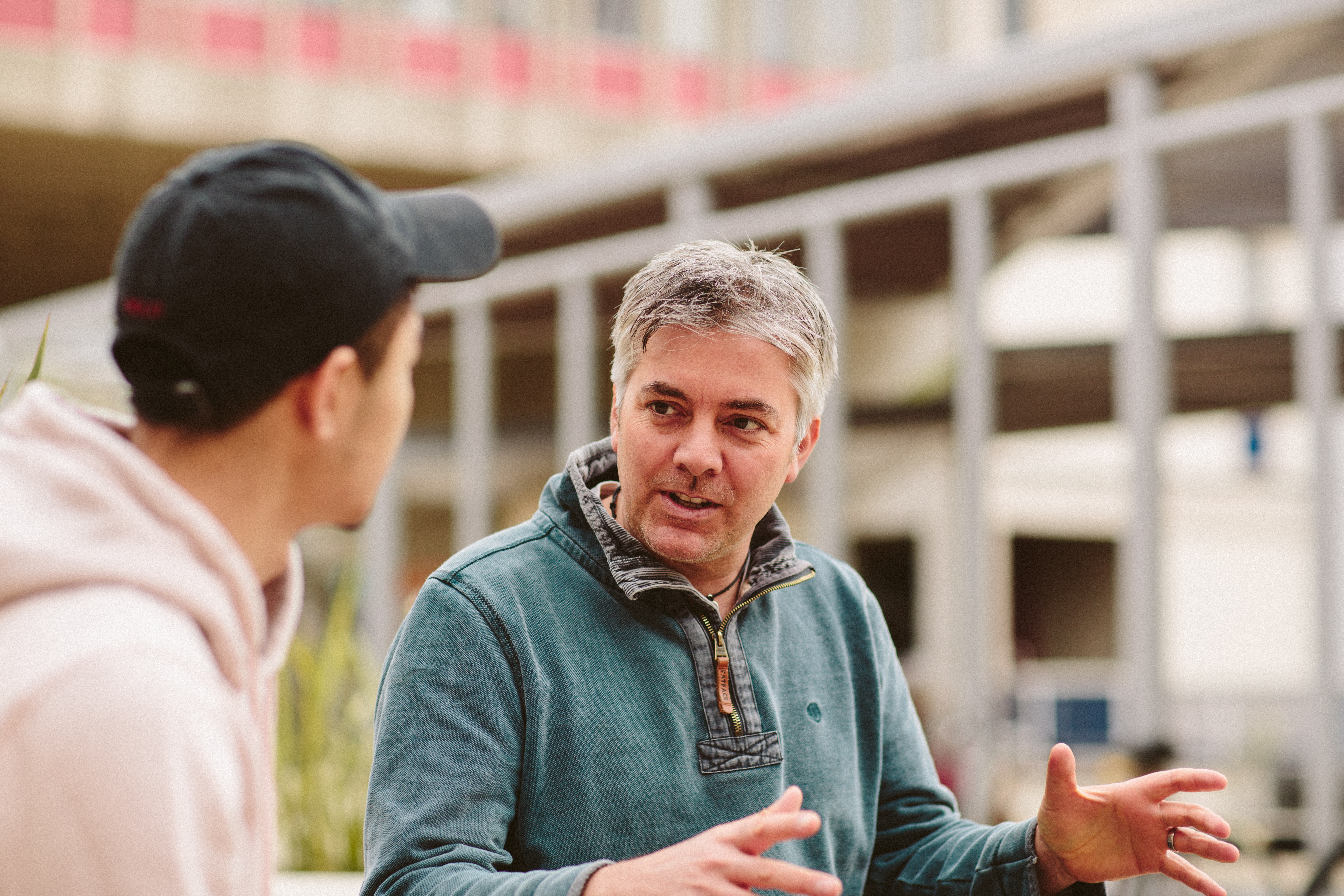 FE teacher talking to a student